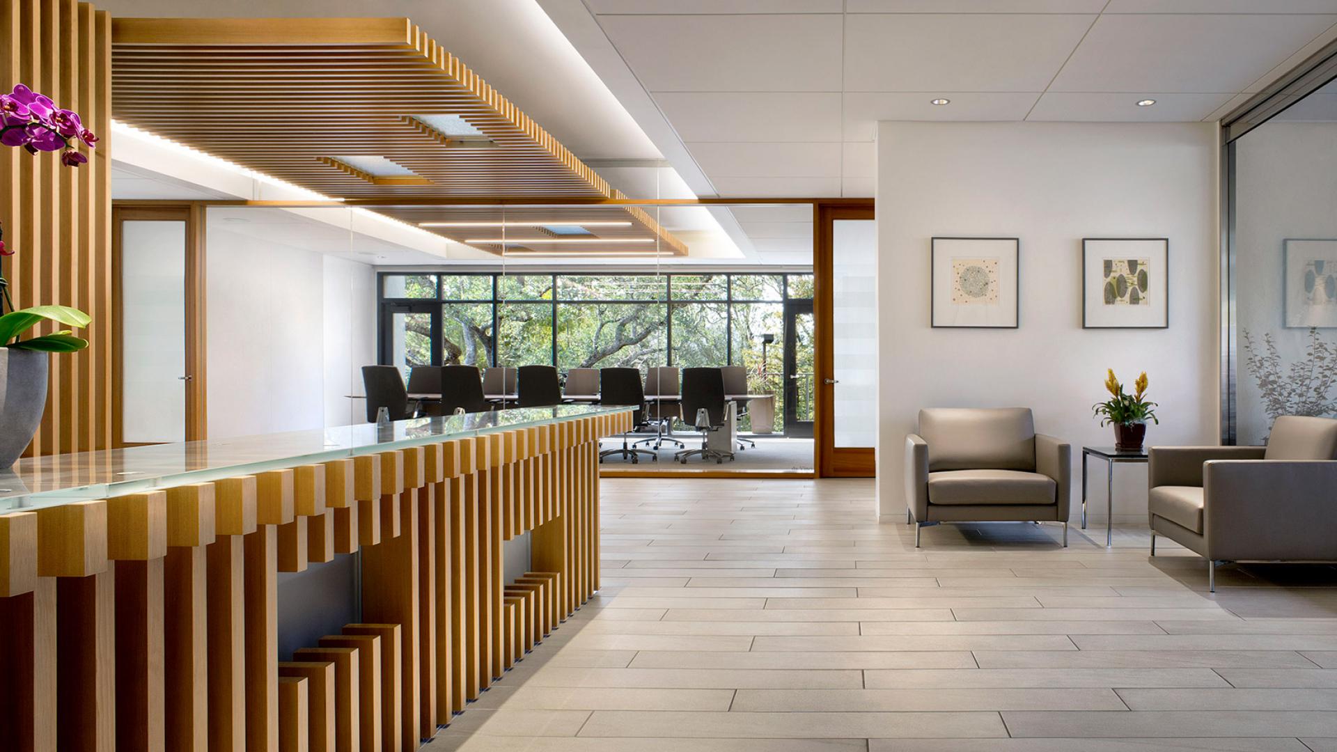 Reception with views through the conference rooms open up to the oak trees beyond