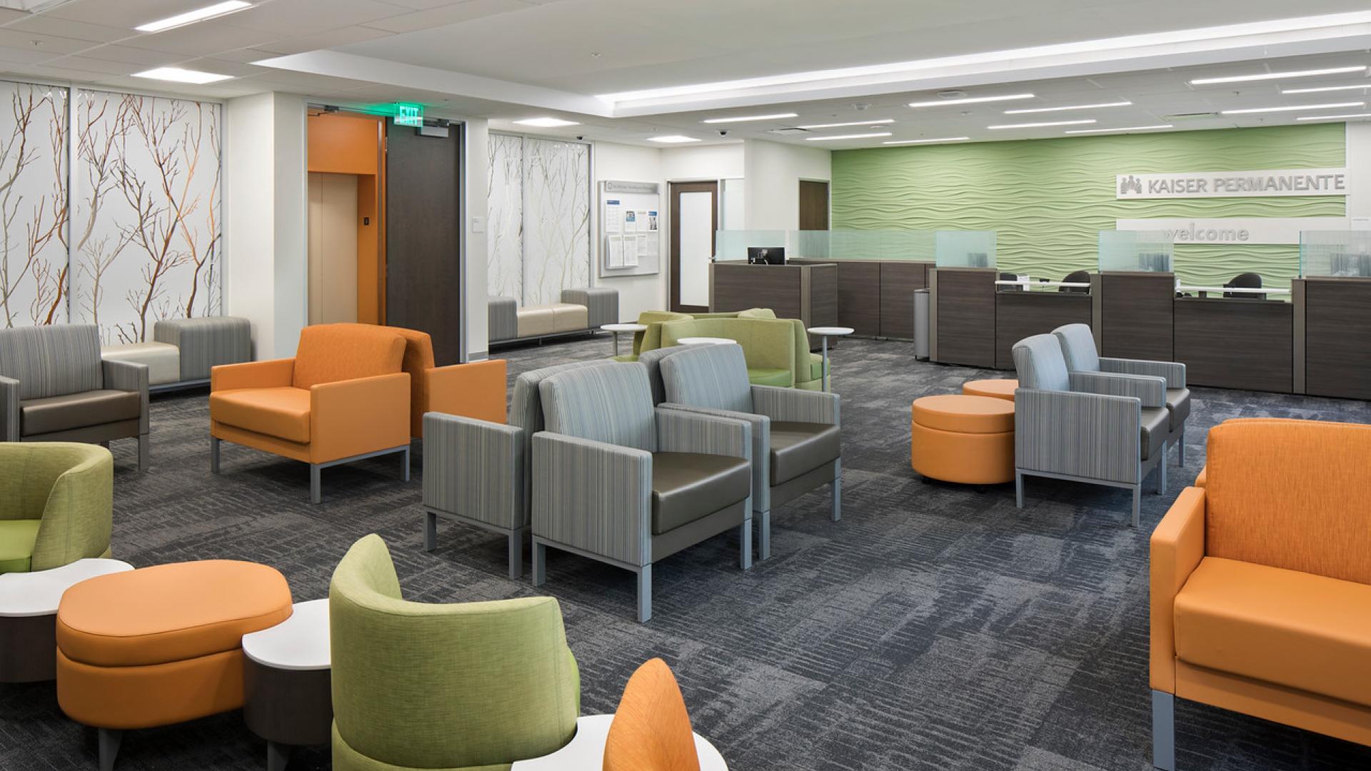 Patient Waiting with colorful furniture and translucent glass art with nature motif