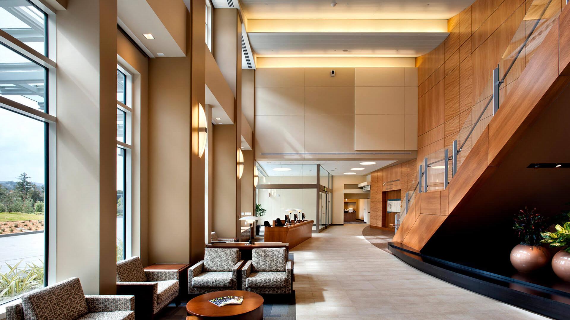 Entry lobby with warm wood, hospitality feel