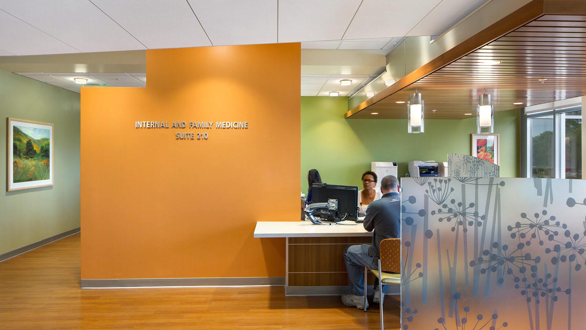 Colorful wayfinding elements and 3Form art privacy screen