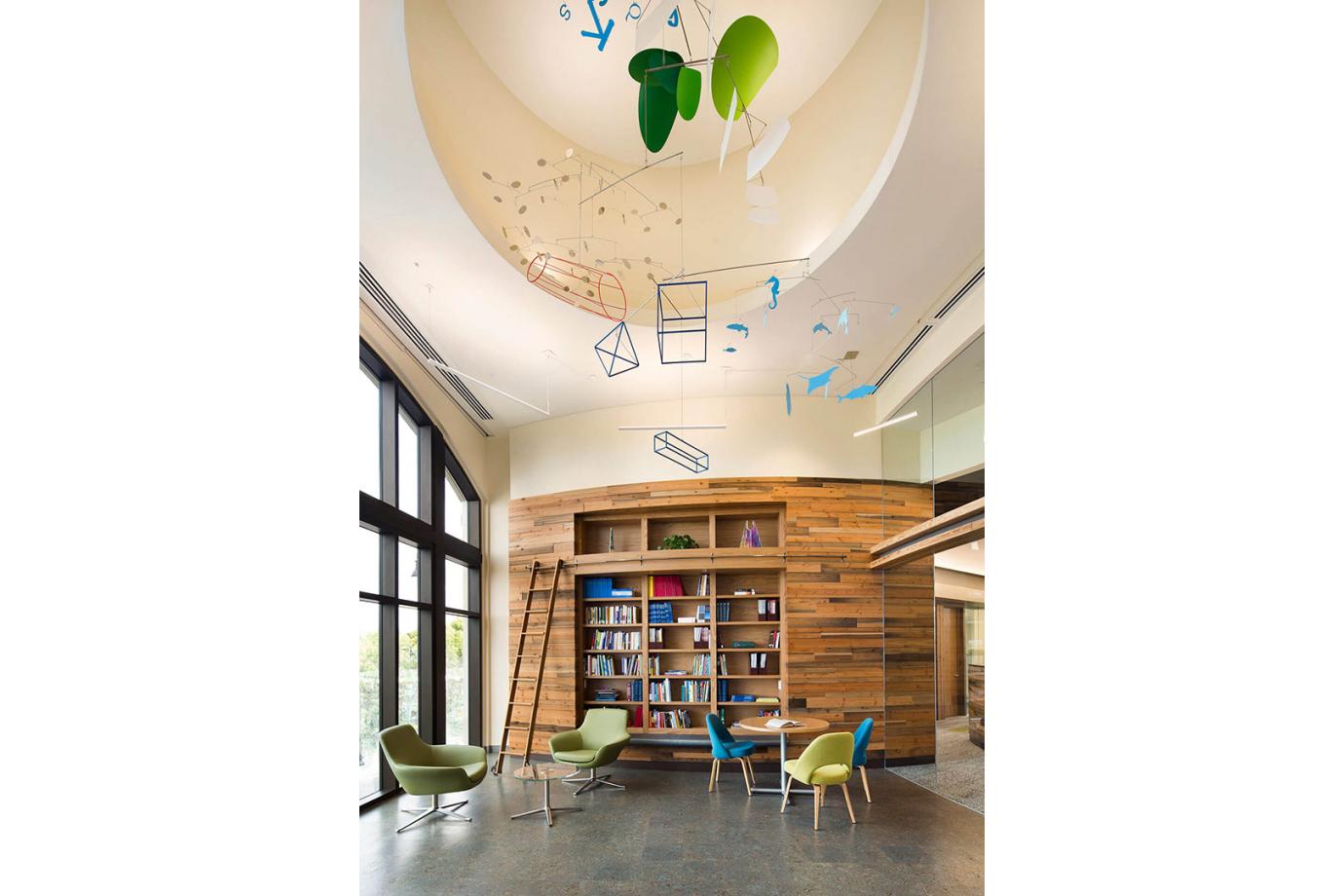 Artwork throughout including a commissioned sculpture in the high ceiling of the collaboration café reflects the aspirational goals of the Foundation.