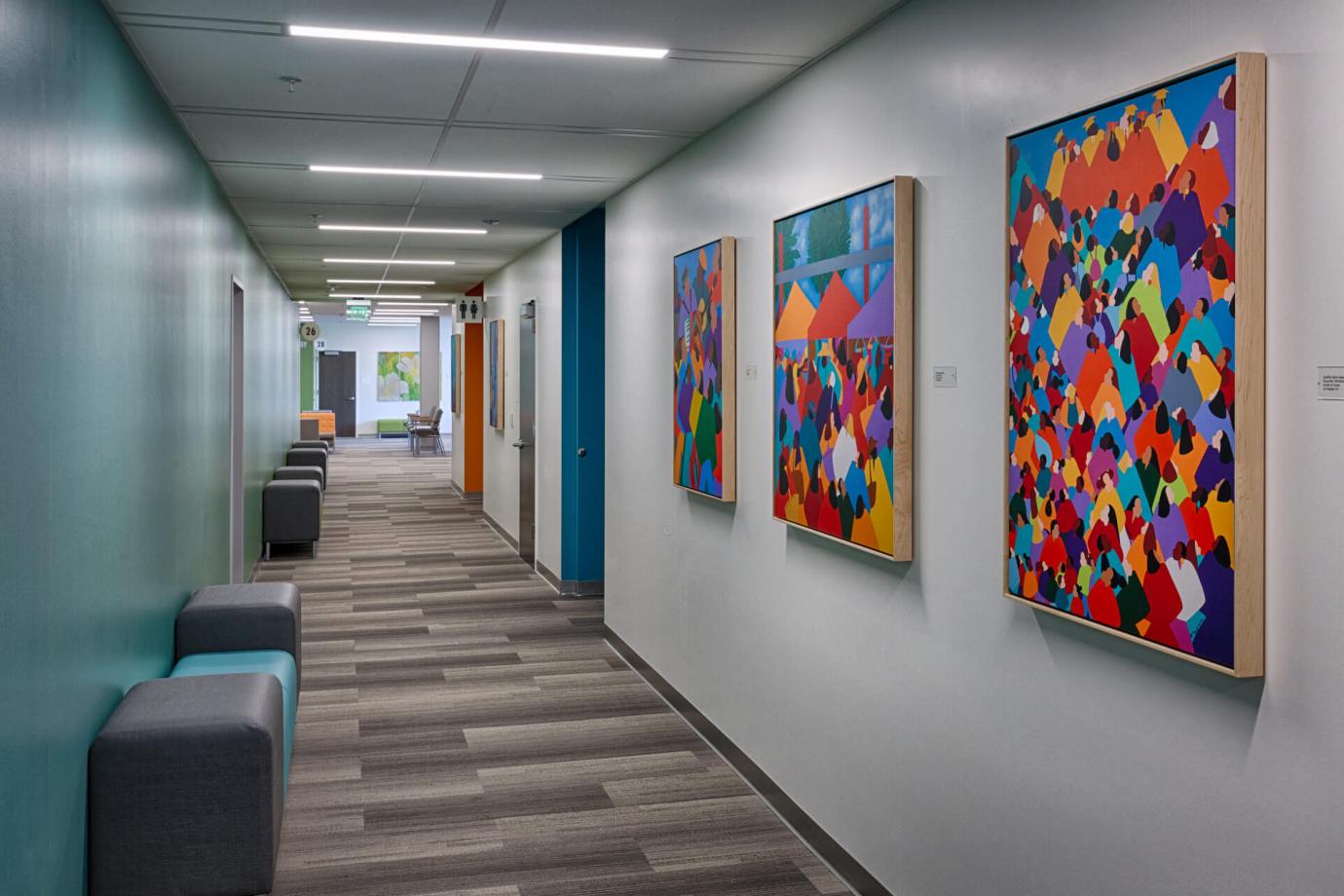 Patient corridor featuring art by local artists and areas of respite