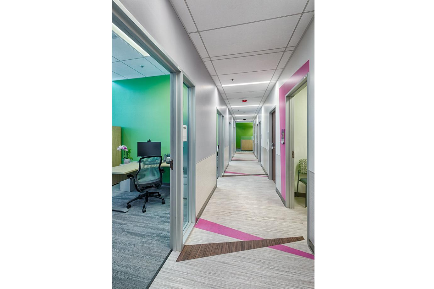 Color and art are used to reinforce wayfinding in the clinic areas. Each hallway has a different color accent, aiding the staff 5. in directing visitors and helping patients find their way from exam rooms back to the waiting area.